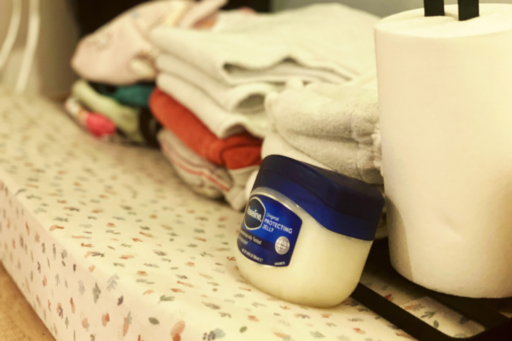 the image shows cloth diapers and petroleum jelly vaseline with insert liner 