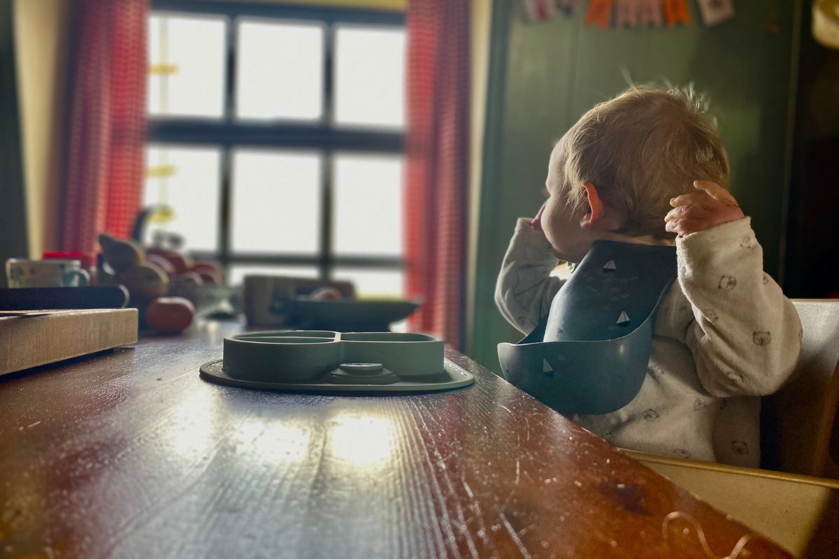 baby eating on a breakfast table