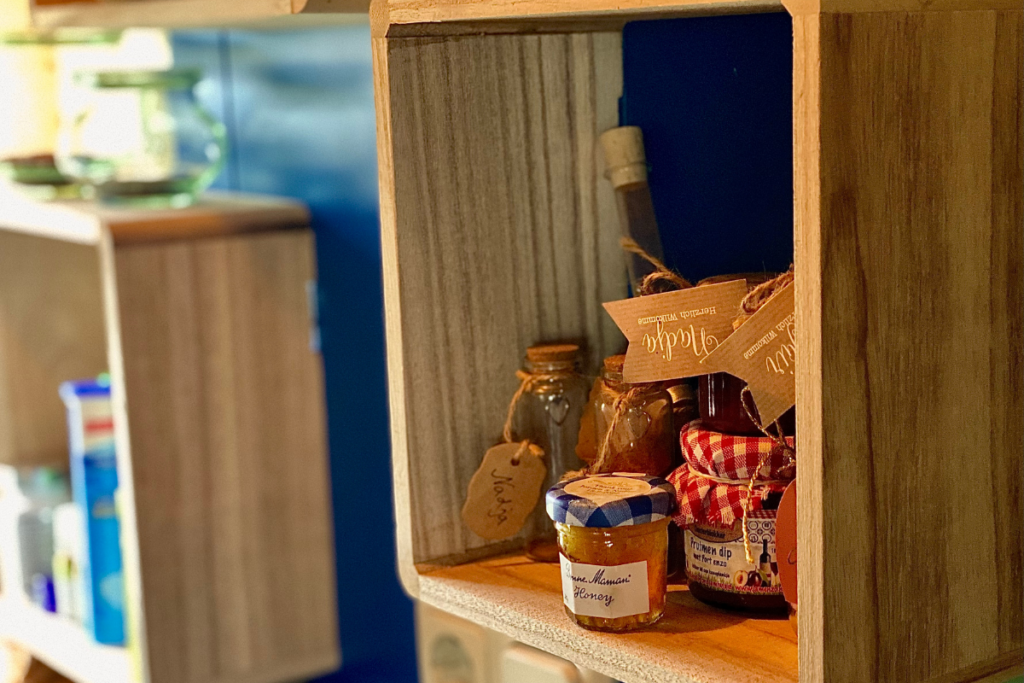 open shelf with little pots inside