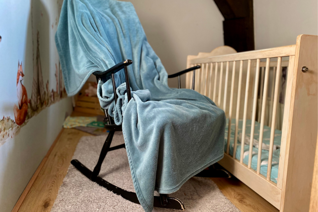 Rocking chair next to baby crib