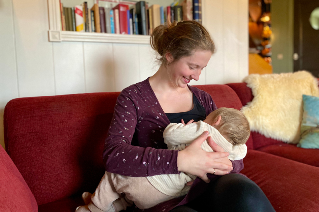 women looking down on breastfeeding baby