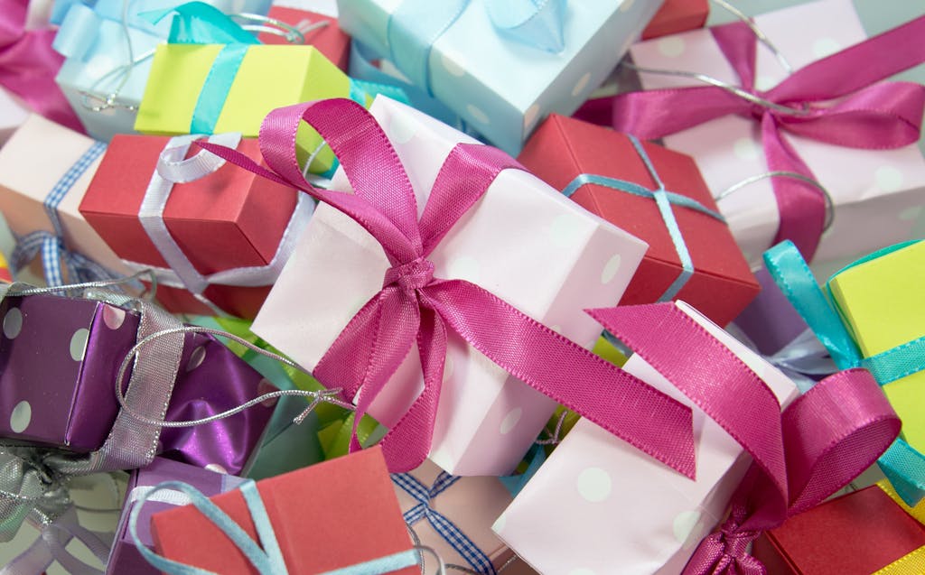 A vibrant collection of gift boxes with colorful ribbons, ideal for celebrations.