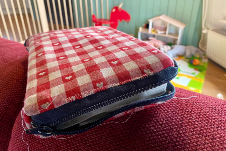 book laying on a sofa with play room in background